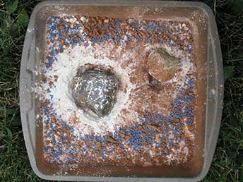 Asteroid Impact Model with flour, sprinkles, cocoa, and rocks