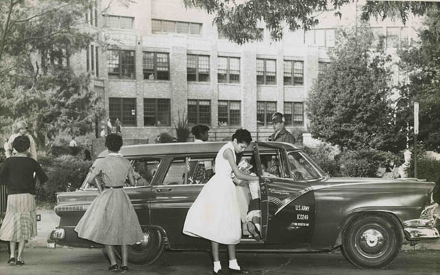 Five of the Little Rock Nine and a soldier arriving at Central High under federal troop escort.