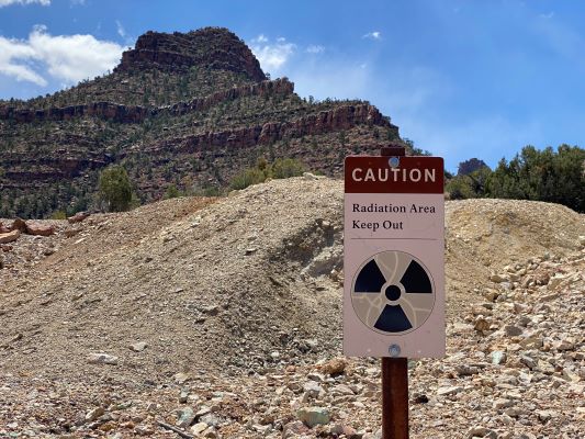 A sign that says “CAUTION: Radiation Area, Keep Out” along a trail at Grand Canyon National Park.