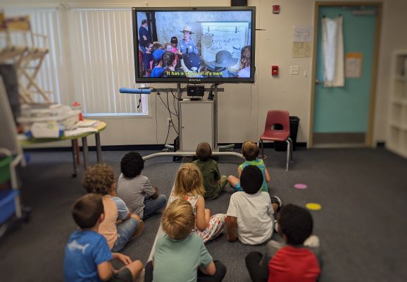 Image of students watching a ranger at the fort on their computer screen. Image of students watching a ranger at the fort on their computer screen.