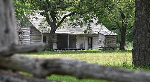Wood cabin surrounded by trees Wood cabin surrounded by trees