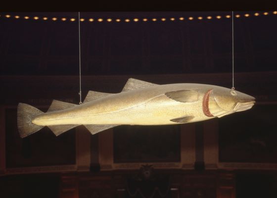 A wooden carving of a cod-fish that hangs in the Massachusetts State House.