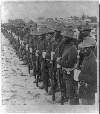 African American soldiers standing in a line with rifles