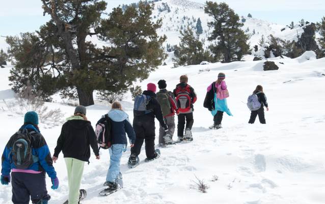 students on snowshoes