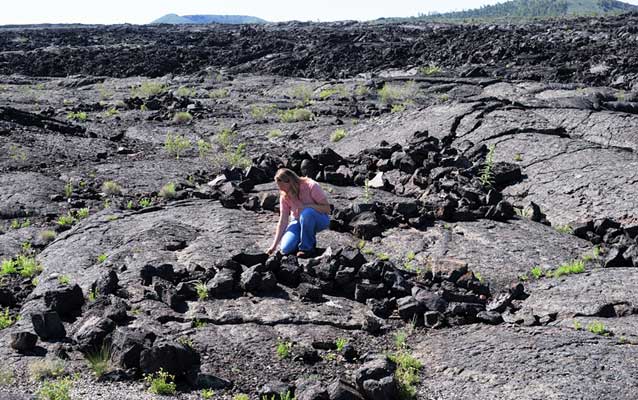 woman next to rock rings woman next to rock rings