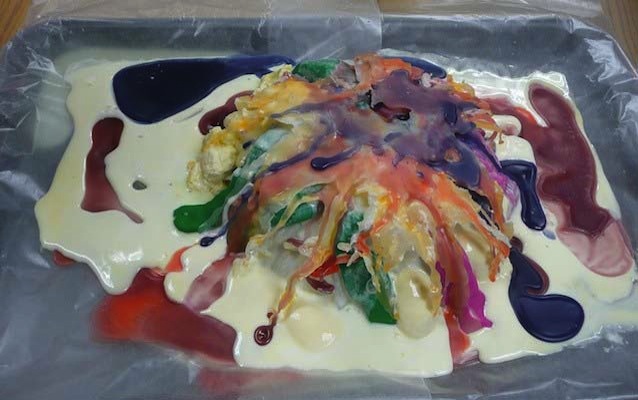 A mound of melting ice cream draped with hot wax A mound of melting ice cream draped with hot wax
