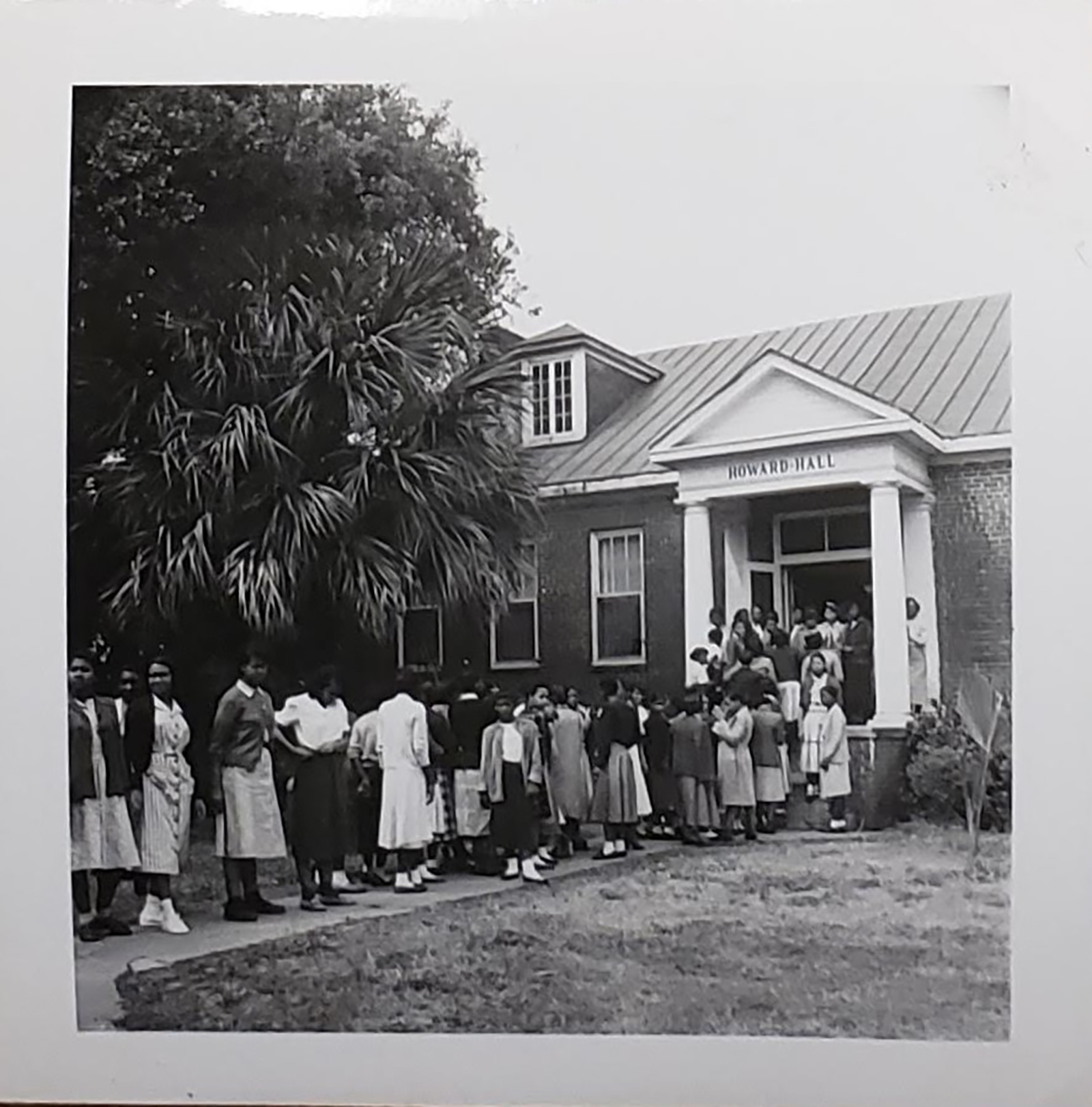A line of students walks into Howard Hall in the 1950s.