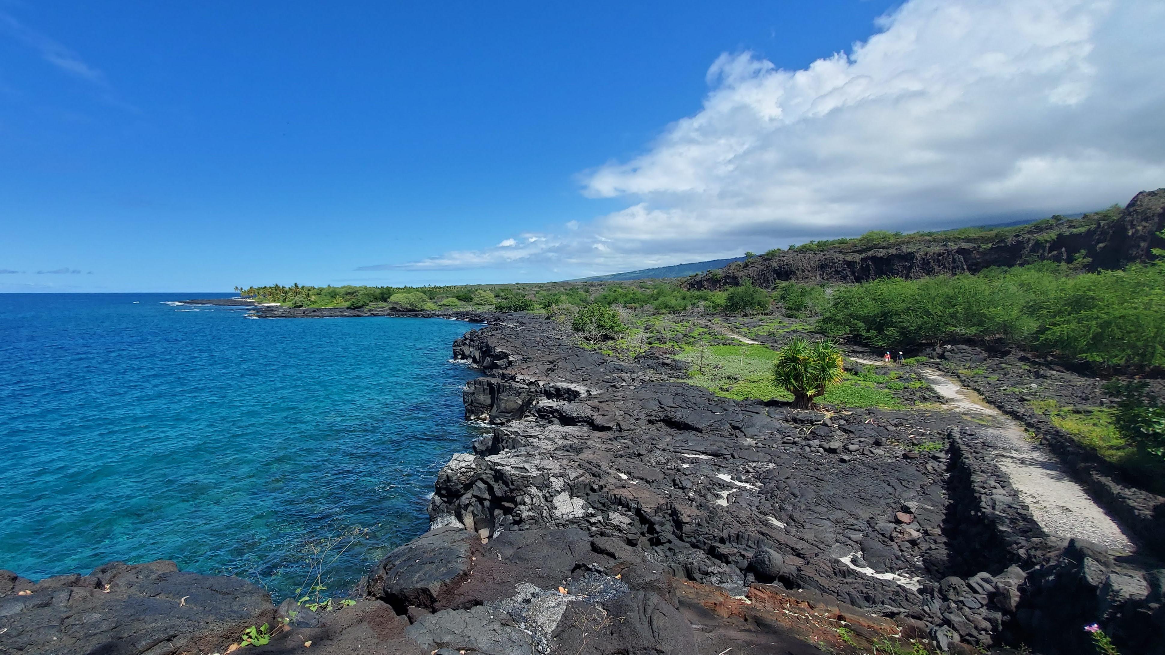 An expansive view of the South Kona coastline with 1871 trail running parallel to the shoreline.