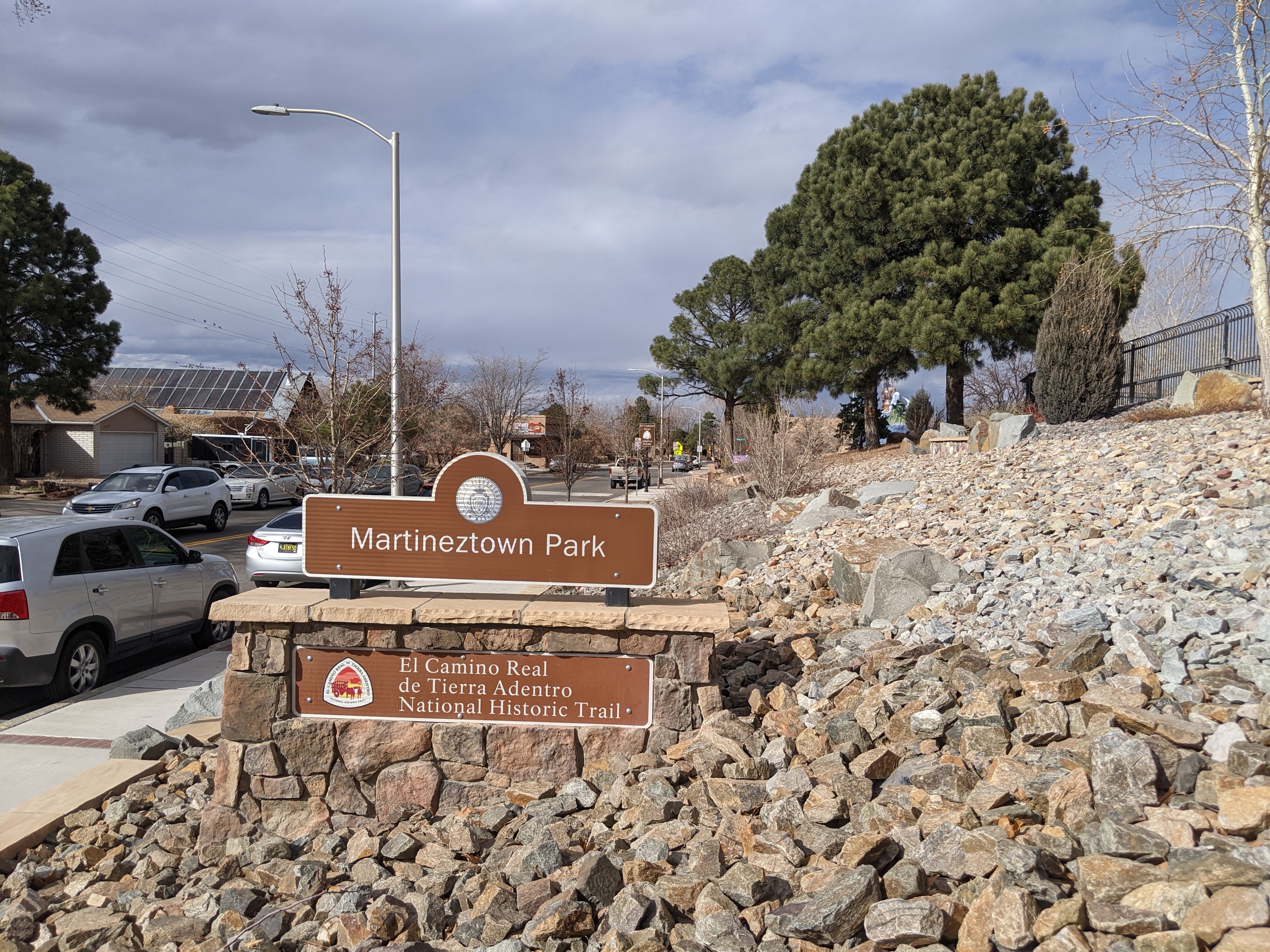 Brown and white monument sign for Martineztown Park in Albuquerque, NM. Historic stop on El Camino.