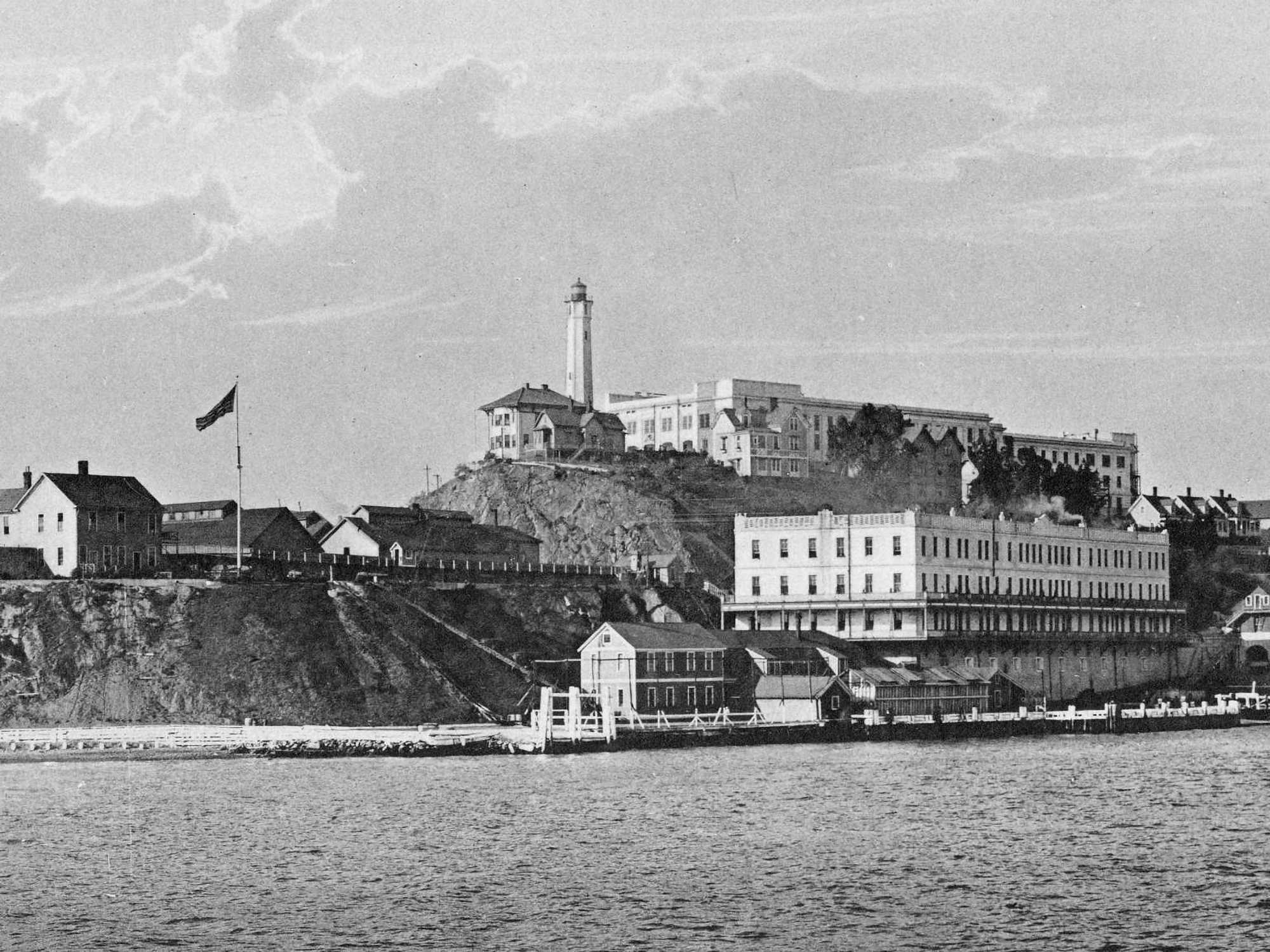 Black and white photo of the dock on Alcatraz as seen from the water
