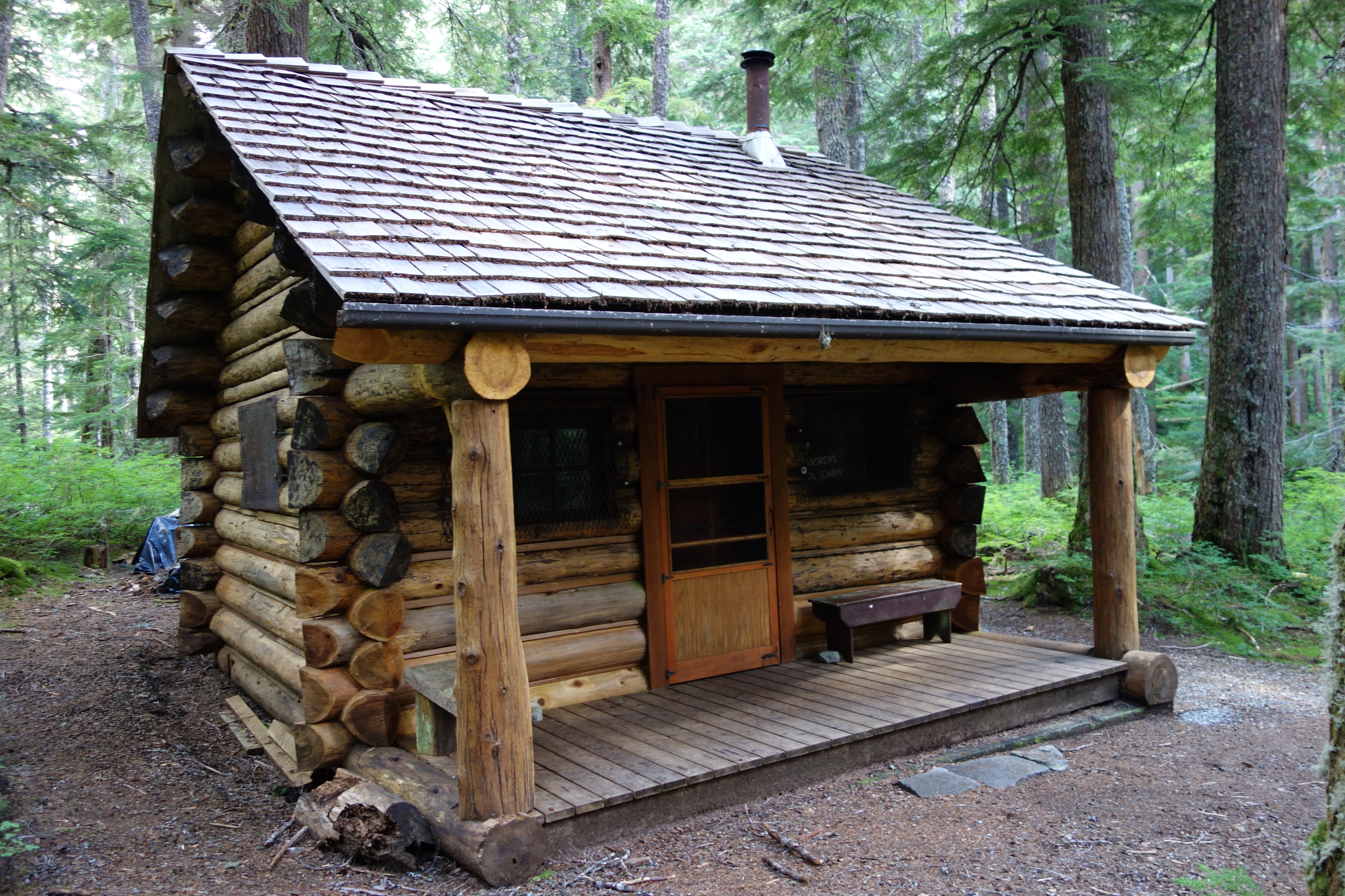 Log cabin surrounded by trees