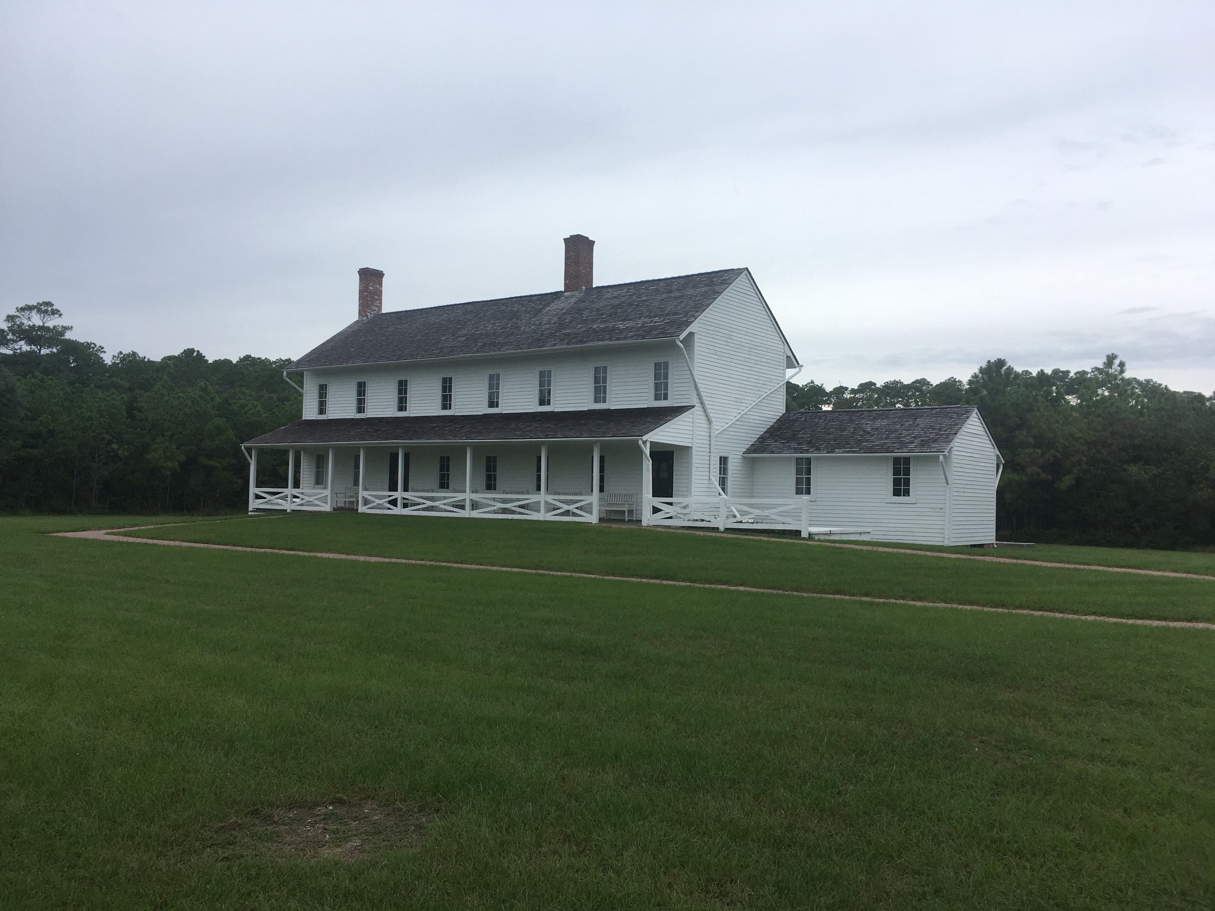 White Building in a green grassy field