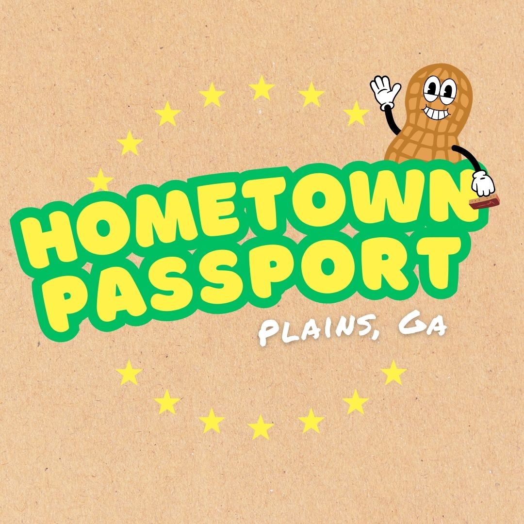 The text Hometown Passport, Plains, GA surrounded by stars and waving peanut figure holding a stamp.