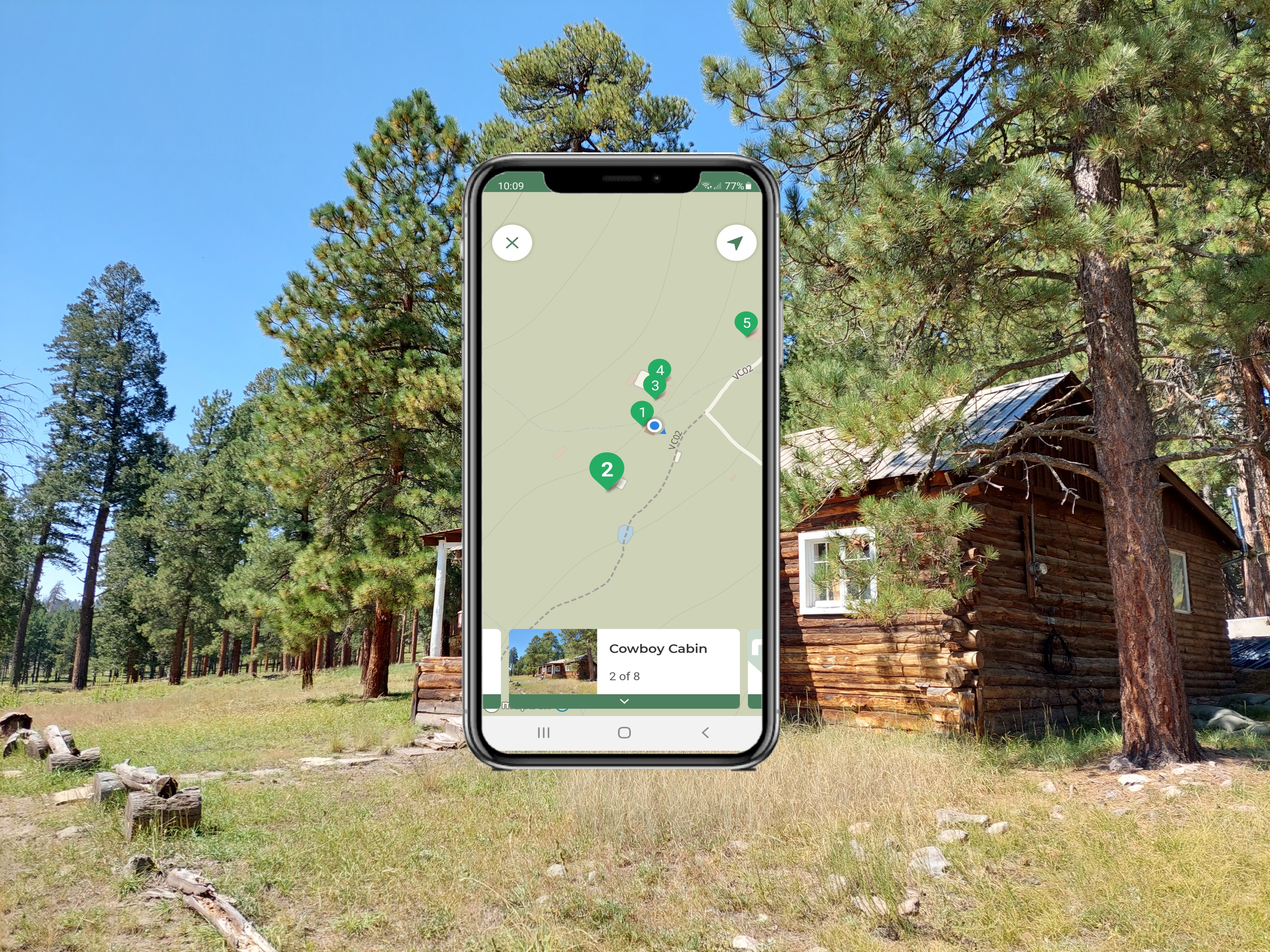 A log cabin with a mobile phone image overlain above.