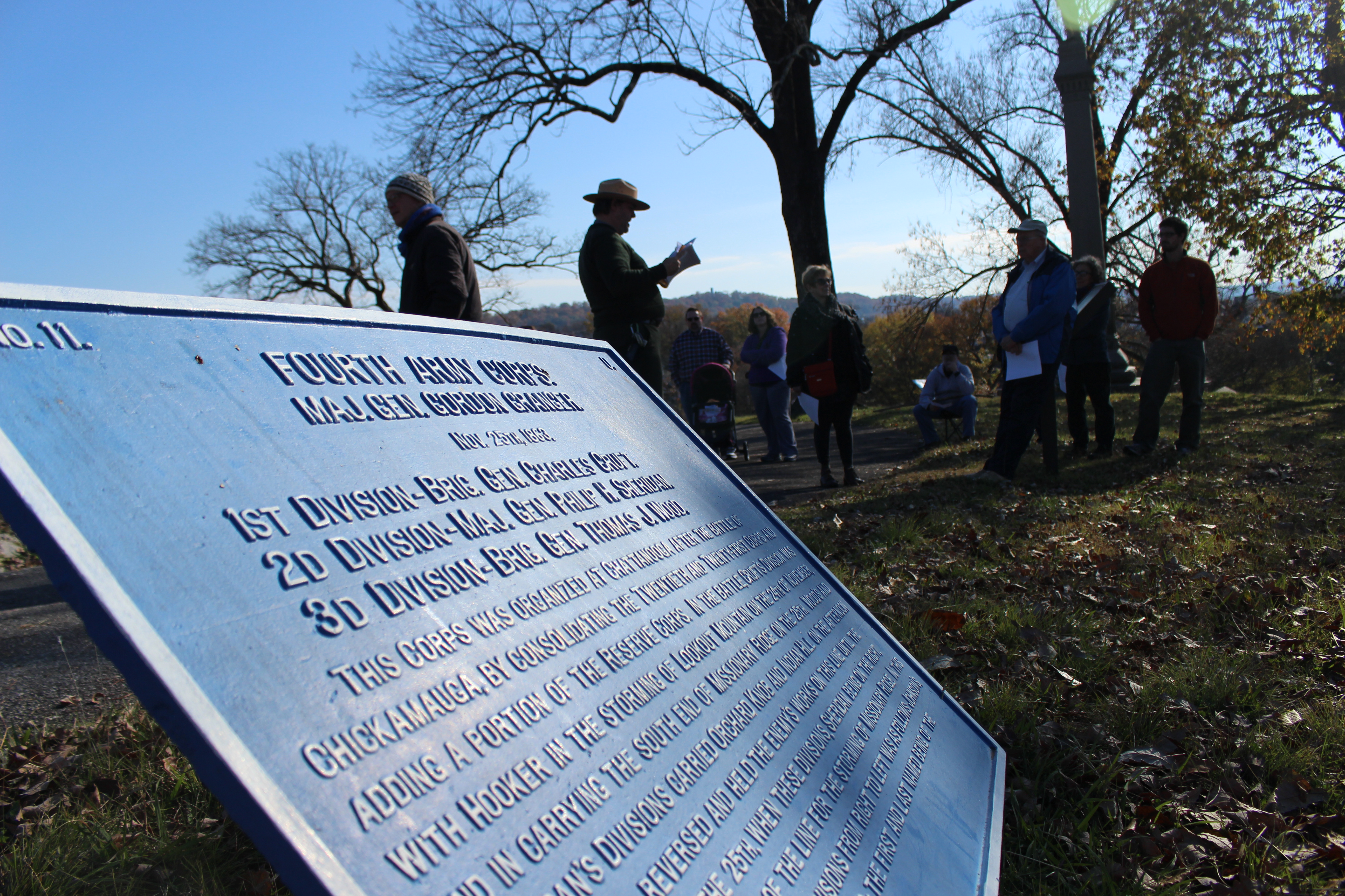 A park ranger leads a tour of Orchard KNob