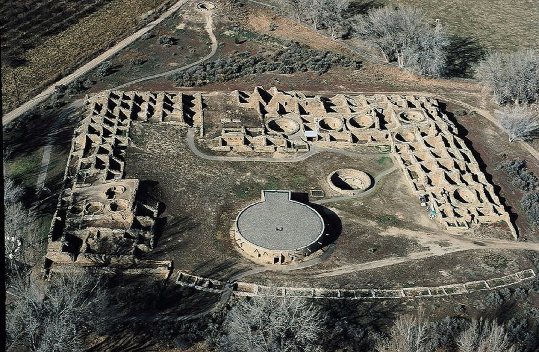 An aerial view of the Aztec West great house showing dozens of open rooms and circular kivas.