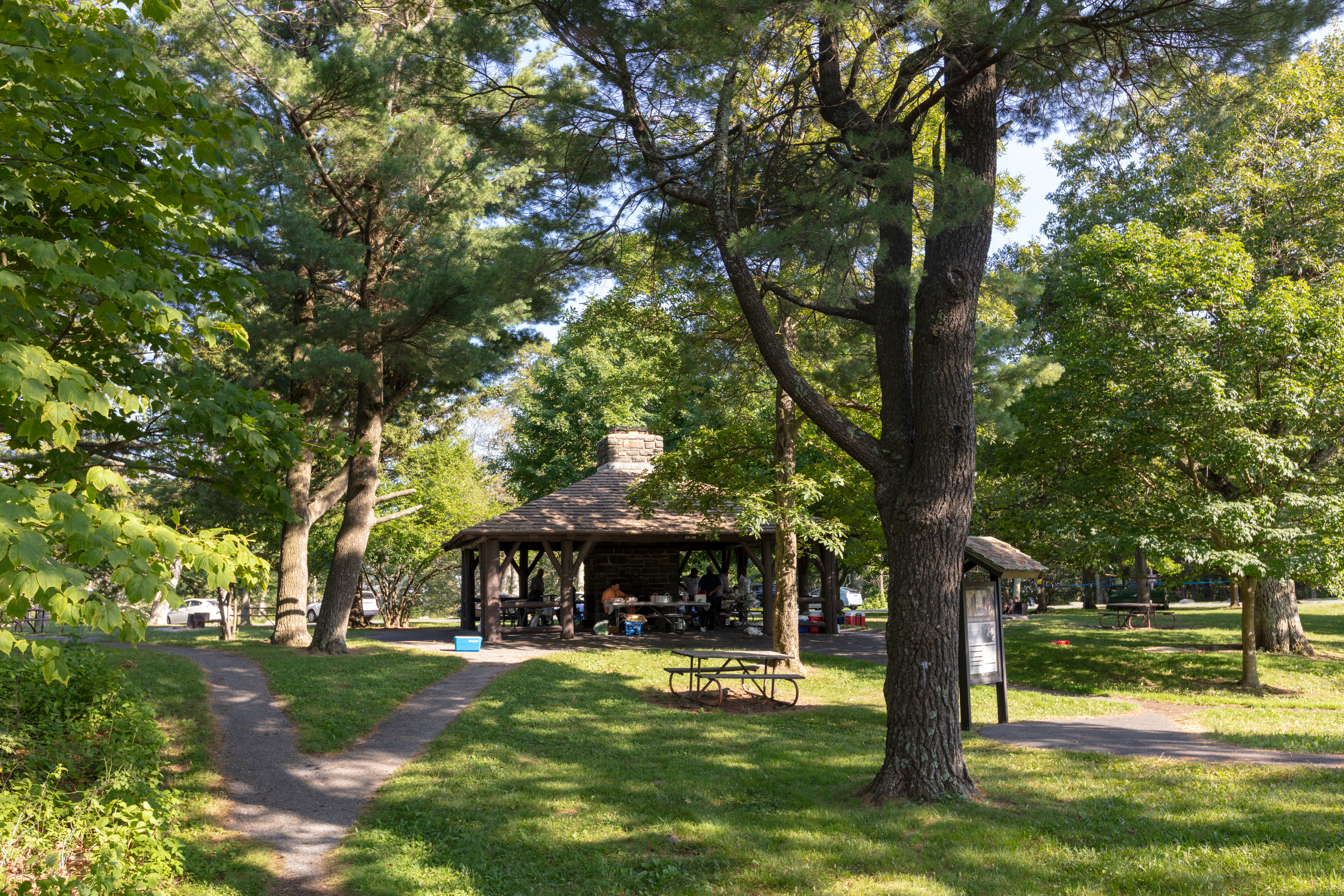 Visitors having a gathering at shelter at Pinnacles Picnic Grounds.