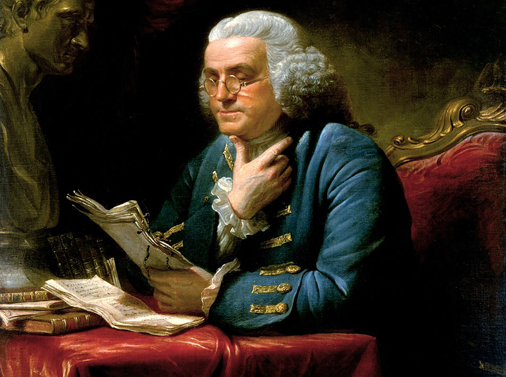 A color image of an 18th century portrait of Benjamin Franklin reading a stack of papers in his hand