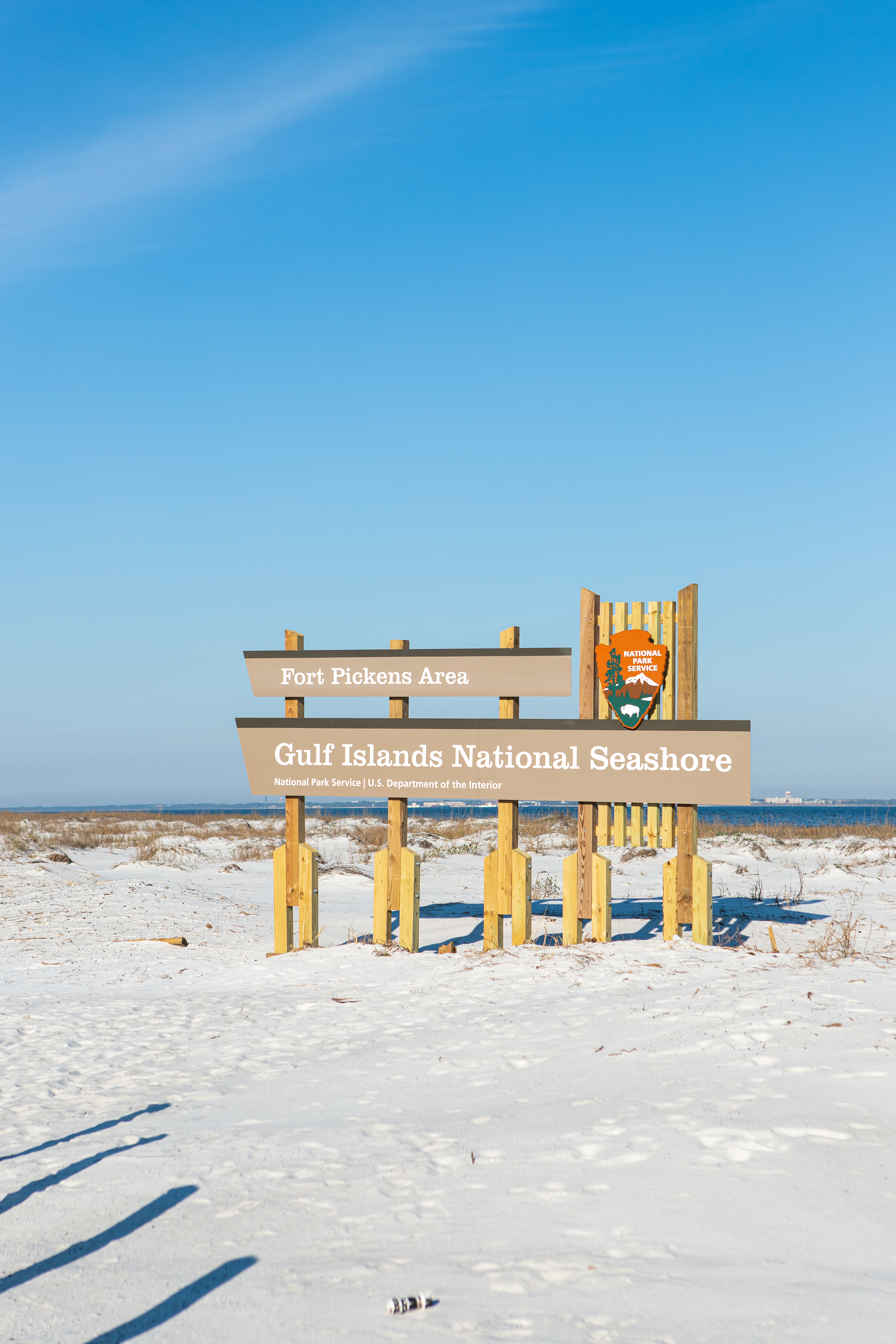 A large sign on the road welcomes visitors to the Fort Pickens Area.