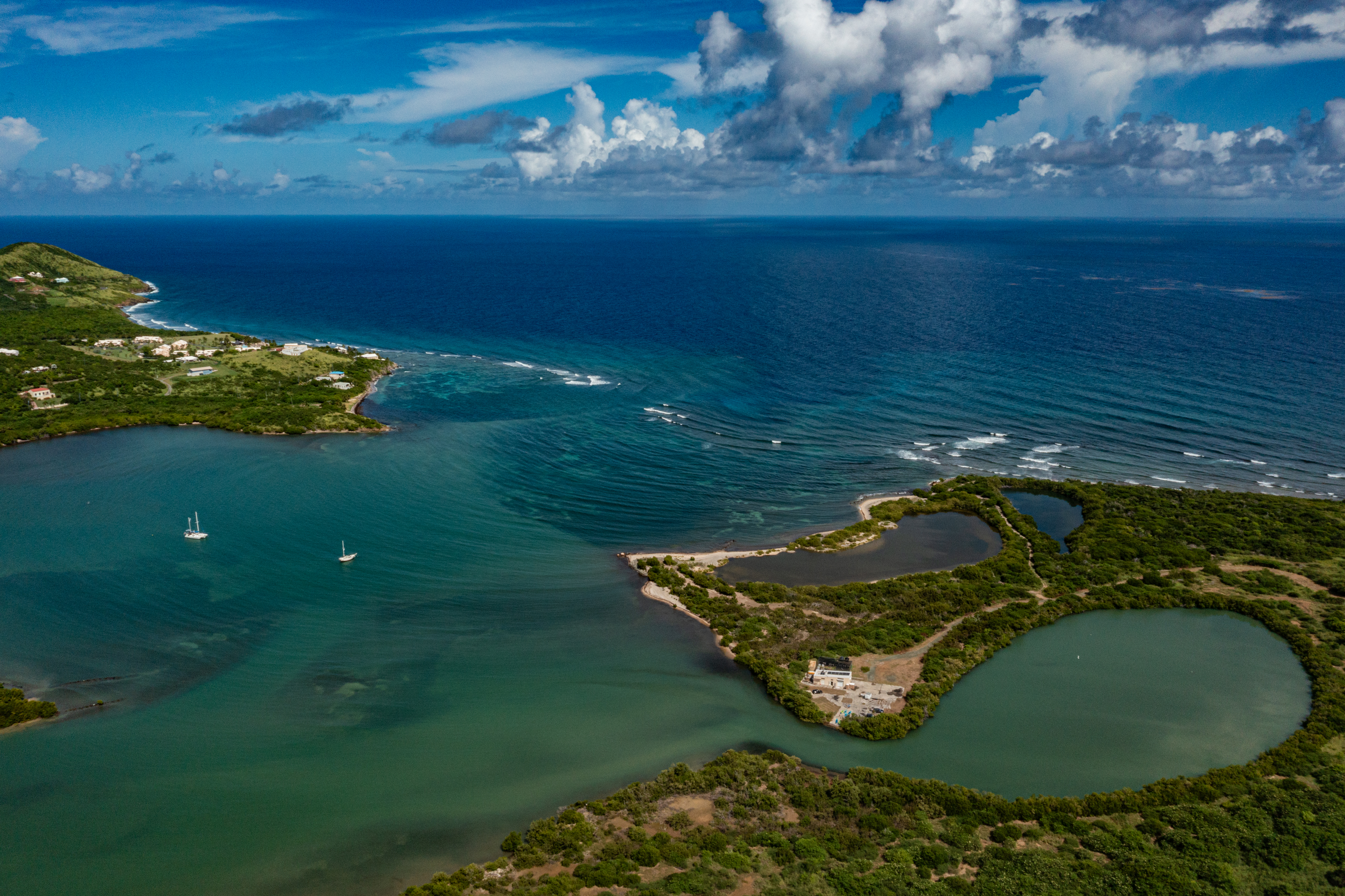 Aerial view of Salt River Bay showing mangroves, lagoons, reefs, and the Caribbean Sea.