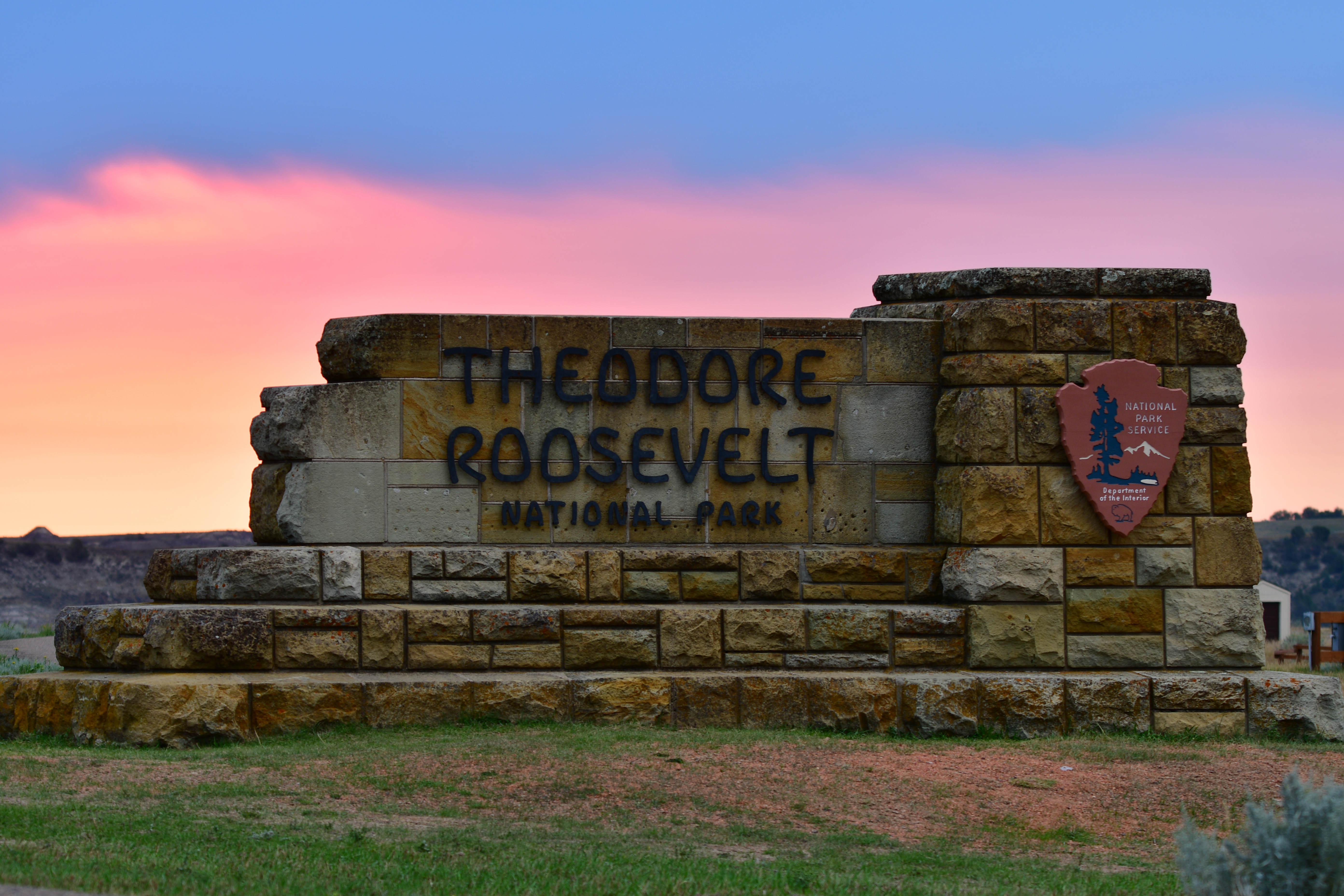 Painted Canyon Sign at Sunrise