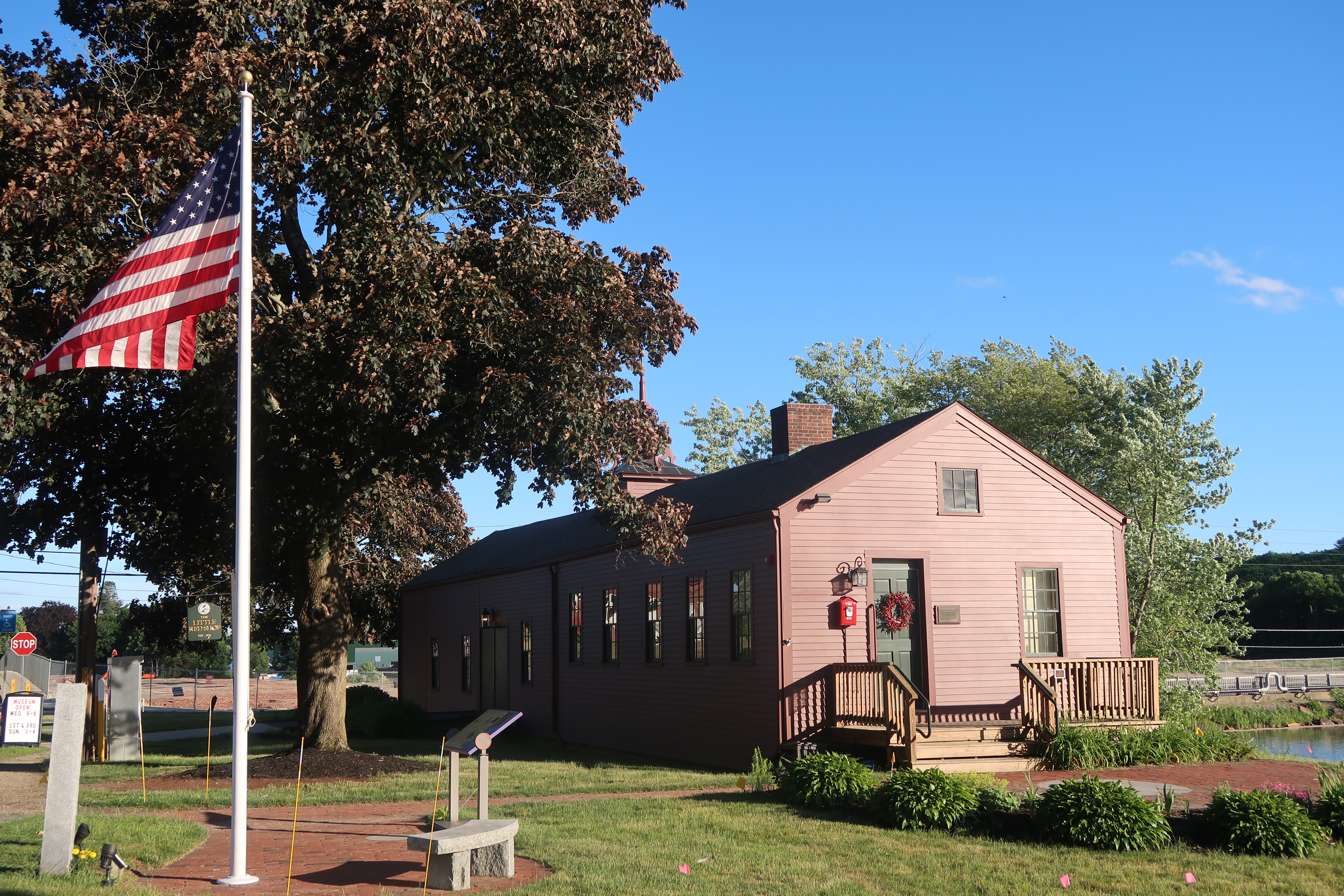 Red wooden structure with American flag