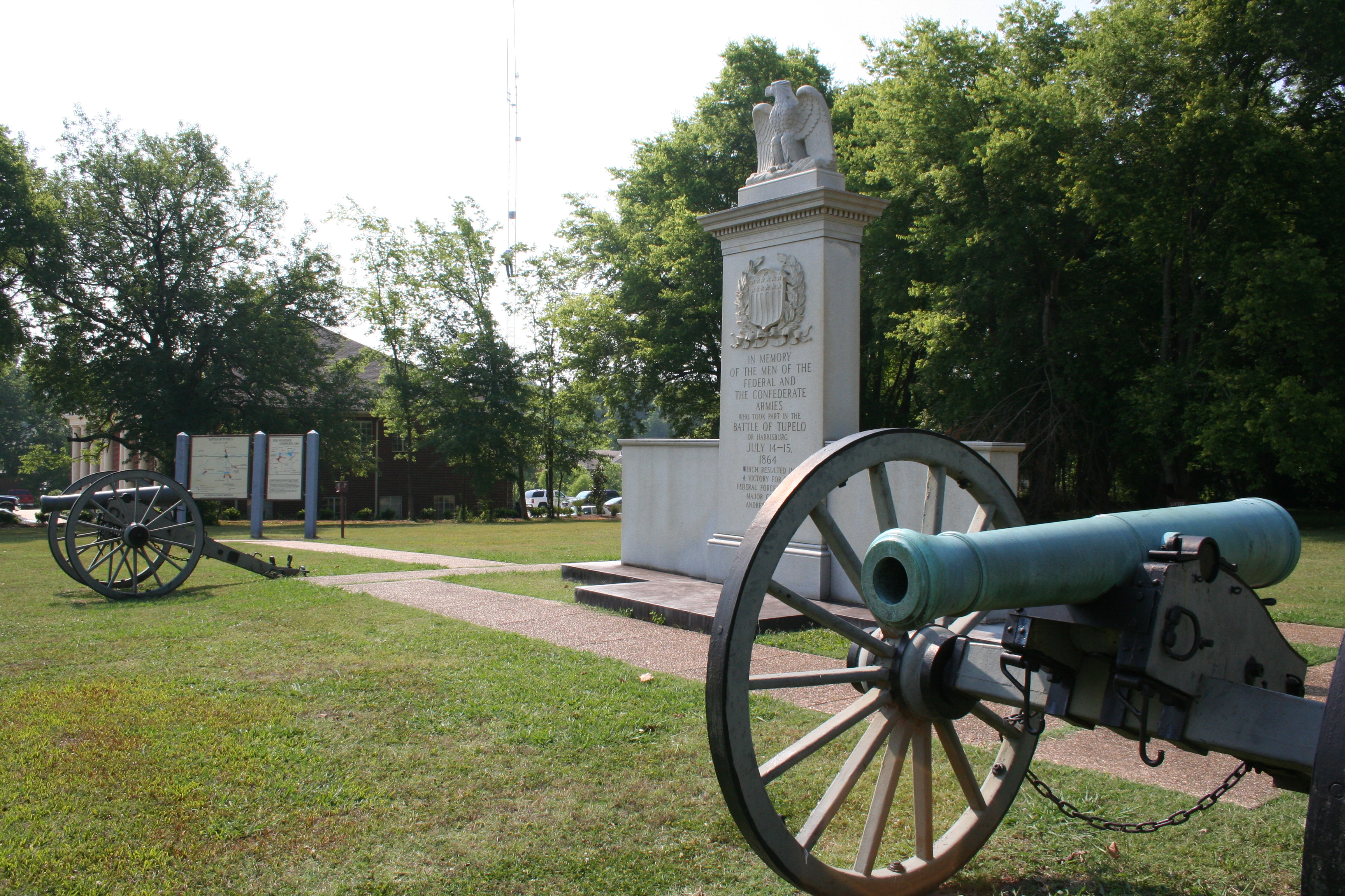 Granite monument commemorating the Battle of Tupelo with civil war cannons flanking each side