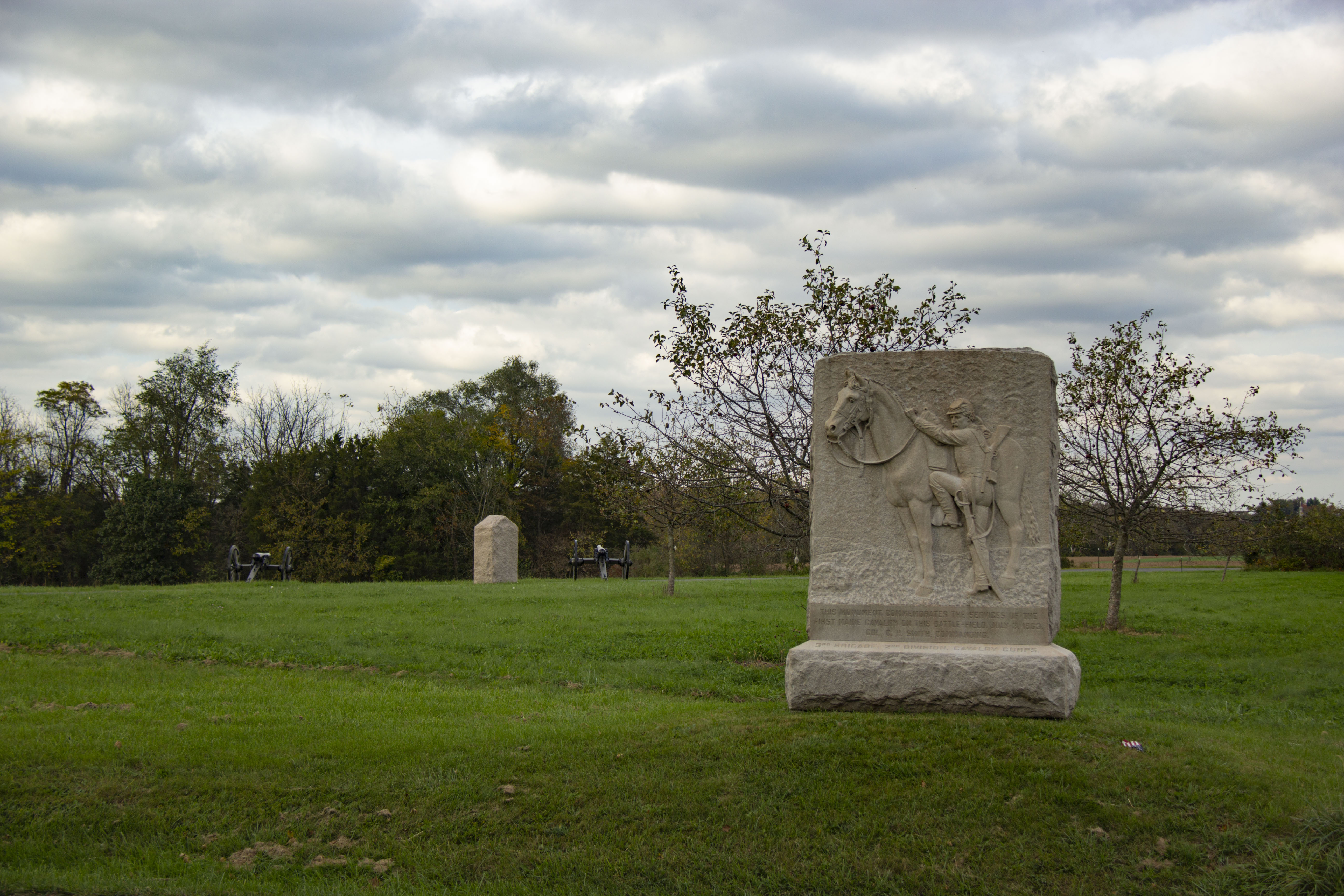A stone monument in an open field