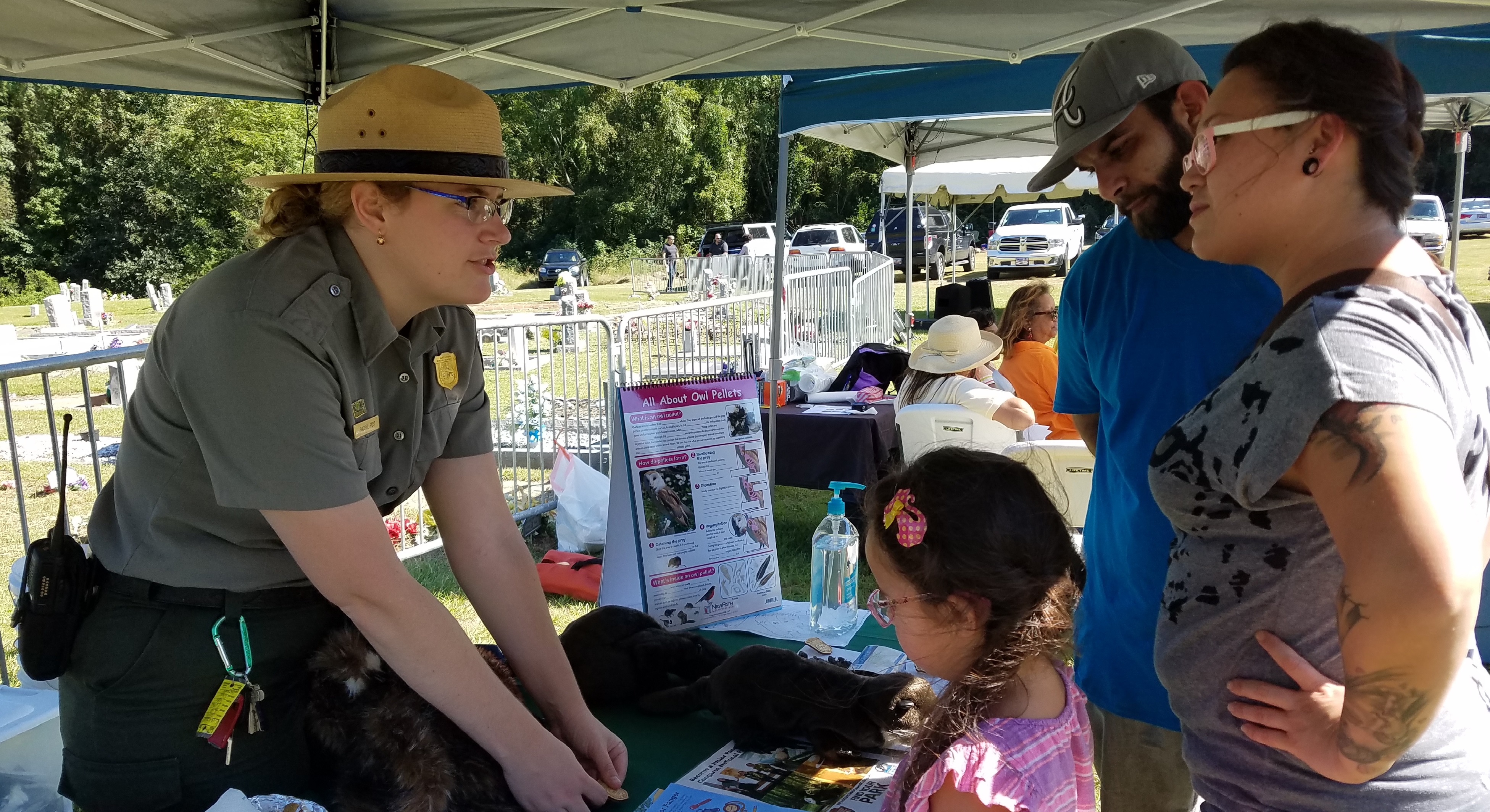 Park Ranger talking with family at special event