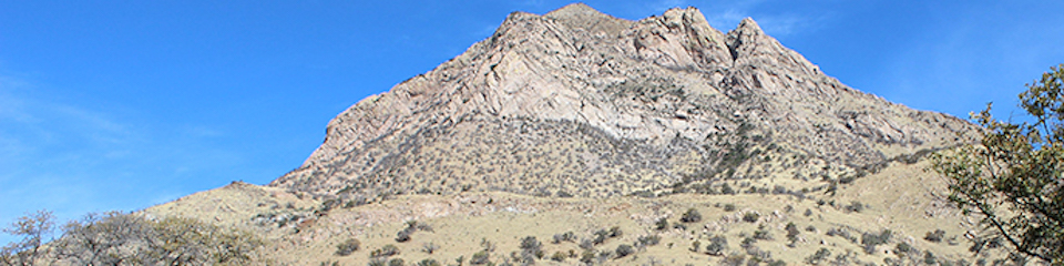 A rocky, pyramid shaped mountain peak