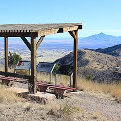 Ramada structure on peak overlooking mountain vista