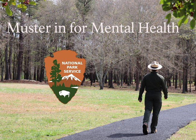 Ranger walks down paved path