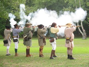 Reenactors firing their weapons