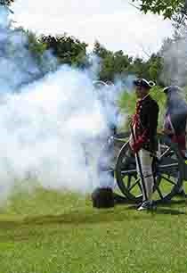 Reenactors fire the cannon at Cowpens National Battlefield. Reenactors fire the cannon at Cowpens National Battlefield.
