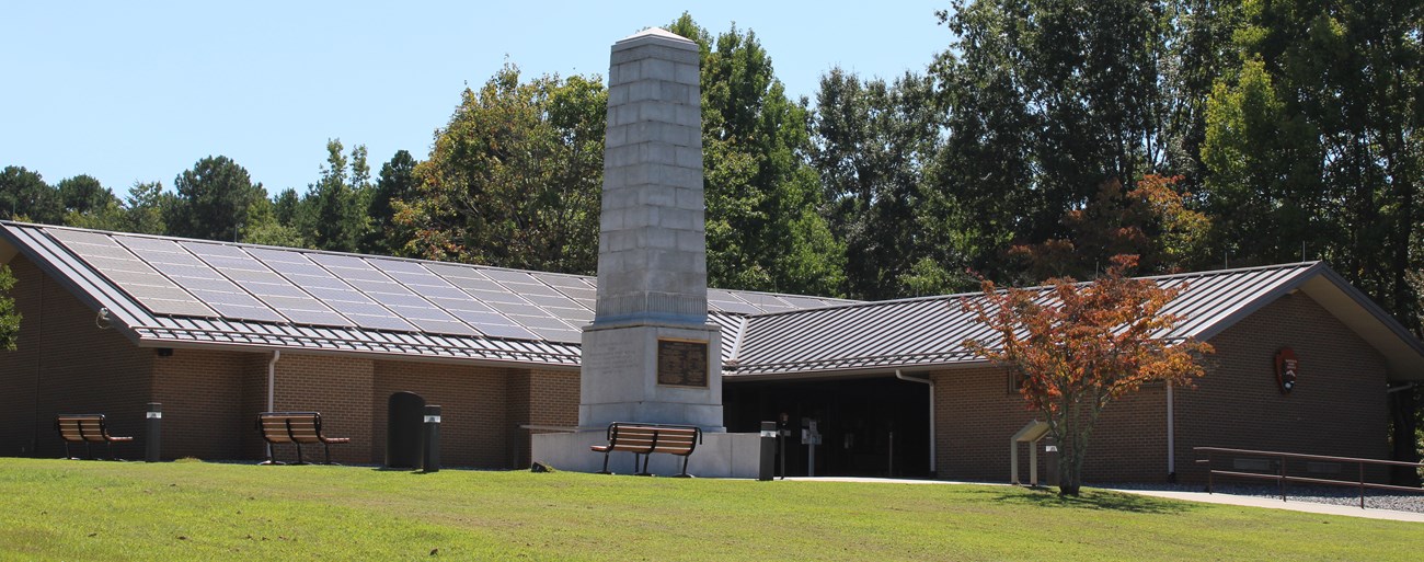 Image of Visitor Center and U.S. Monument