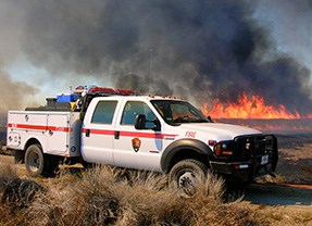 NPS Type 6 wildland fire engine in front of fire