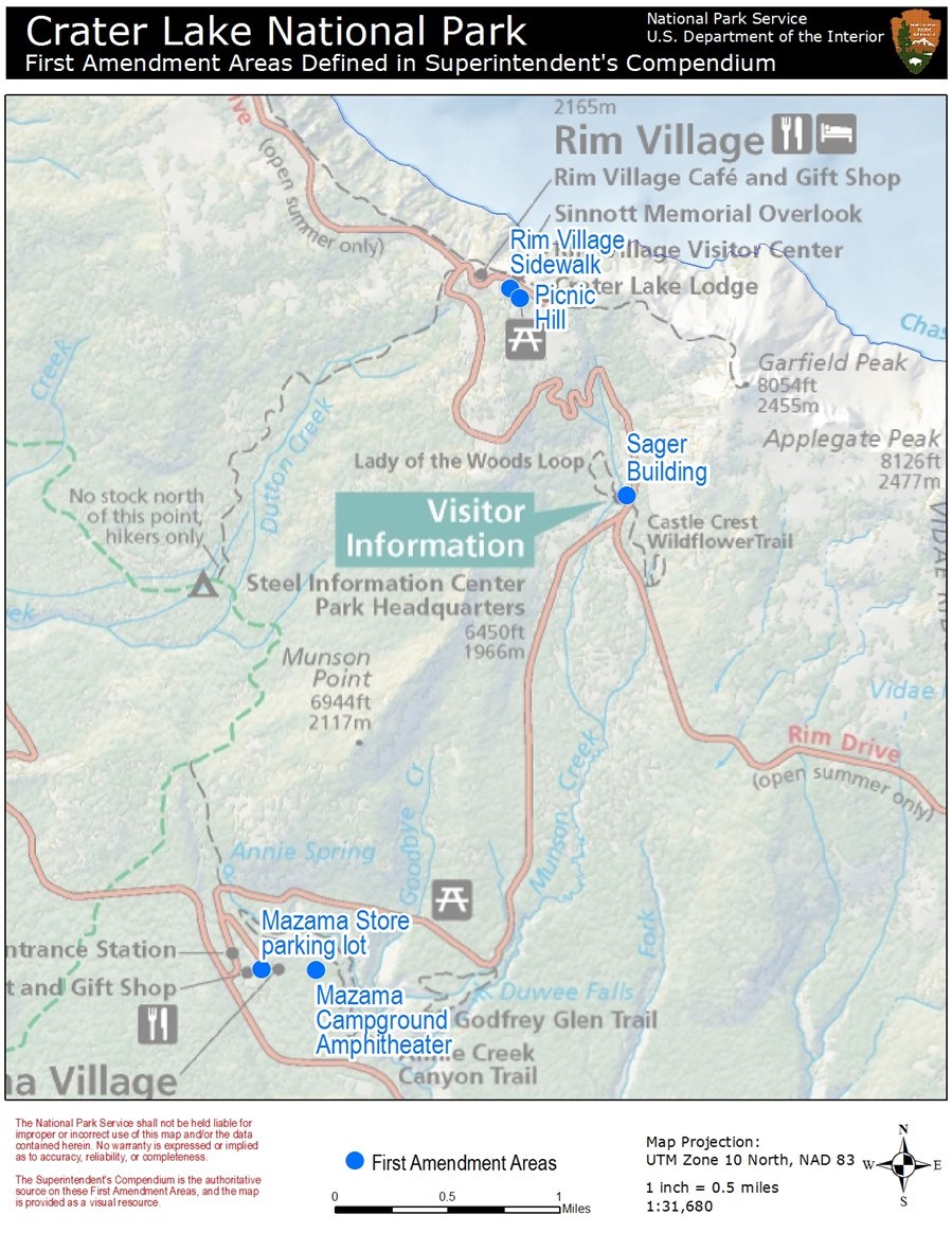 A partial road map of Crater Lake National Park with two blue dots on Munson Valley Road and two blue dots in Rim Village indicate the general areas for First Amendment Rights. Map and park locations not significant to the free speech areas are shaded.