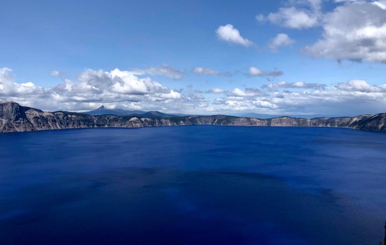 A half-circle view from the center of Crater Lake looking north towards the caldera.