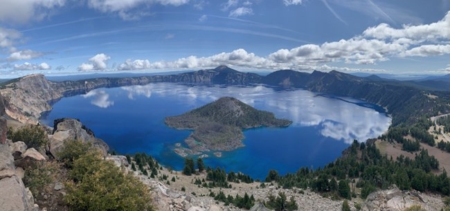 A full view from afar of Crater lake showing caldera and Wizard Island