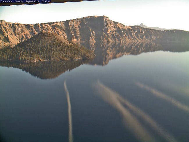 Crater Lake Webcam - Contrails Reflecting in the Lake