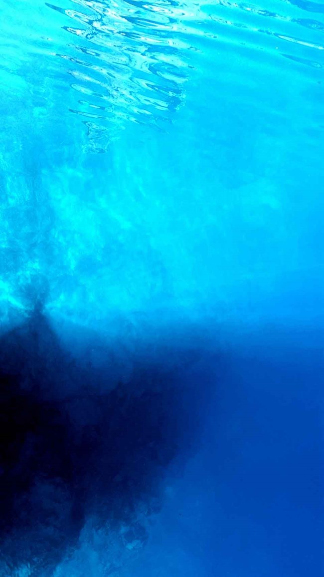 Water in Crater Lake viewed from a boat.