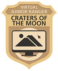 A golden badge with the words "Virtual Junior Ranger: Craters of the Moon" and an image of a computer screen with volcanoes on it.