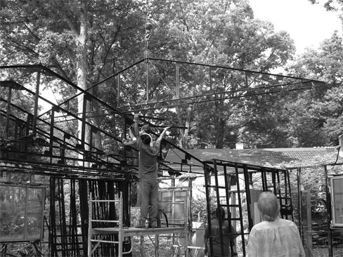 Figure 3: The work crew removes steel framing pieces in the Lustron House.