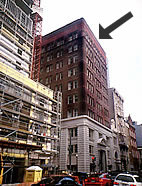 <three photo series>Compatible New Rooftop Addition. The 1-story penthouse (shown)--added on the roof of this historic building--is simple in design, the same color as the historic building, and set back as recommended. It is not visible behind the solid parapet as seen from the street below (shown). While minimally visible from a major thoroughfare several blocks away, the addition does not change the historic character of the building (shown). Photos: NPS files