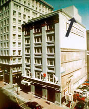 A one-story rooftop addition (shown) on a 6-story historic building is set back from the primary elevation so it is not seen from the street below. Although the taller portion at the rear, in particular, which replaced an existing tower, is visible from a distance, the addition is unobtrusive and does not impact the character of the historic building. Photo: NPS files