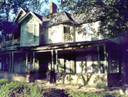  <two photo series> Parking Incompatible with the Historic Character. This former historic residence (shown), which was converted to law offices, had a front yard with bushes and trees prior to rehabilitation. A parking lot (shown) was created in the front yard of this house. It obliterated the front lawn, a significant landscape feature, and compromised the historic setting of this residential property. The parking area would have been largely unobtrusive if it had been placed at the rear of the building or along a less visible side elevation. Photos: NPS files