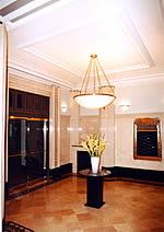 <two photo series> This elegant lobby (shown) with its decorative plastered walls and ceilings, marble flooring and wainscoting, as well as less formal spaces with beadboard walls and simple wood trim (shown), can define the interior character of finished historic spaces. Photos: NPS files