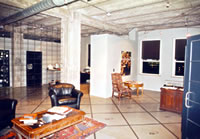 Maintaining Finished Character. This room in a former office building was a finished space with plastered walls and ceilings. Removal of finish materials--whether historic, non-historic, or deteriorated--such as in the example shown here, to reveal structural elements or substrate surfaces that were never intended to be exposed to create a rough warehouse/loft look as a design motif, is not a compatible rehabilitation treatment. Photo: NPS files