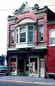 Functional and decorative features of historic storefronts, such as display windows, signs, doors, transoms, lower window panels, and cornices should be identified and preserved in a rehabilitation project. Photo: NPS files