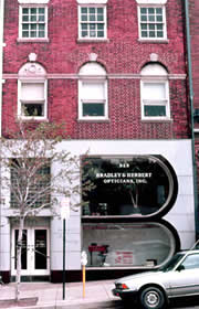 Storefronts constructed throughout a building's history may have gained significance in their own right, such as this 20th-century storefront on an older building. This storefront should be retained. Photo: NPS files